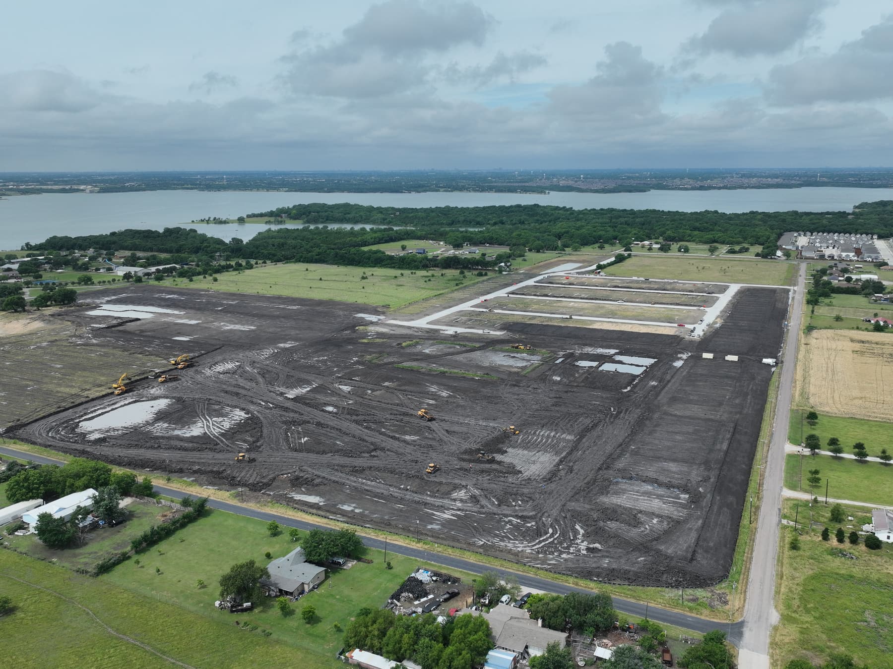 Aerial view of early site work at Arbor Lakes near Princeton, Texas, with Lake Lavon on the horizon