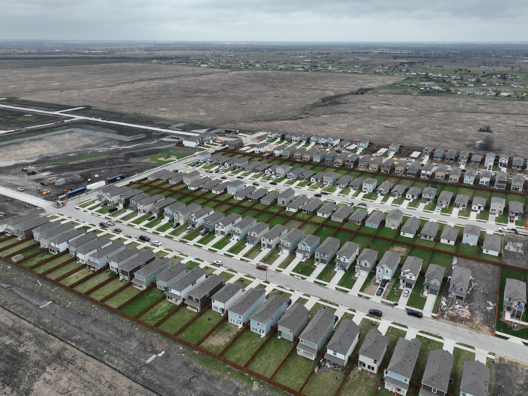 Aerial view of completed, occupied homes on finished streets at Cartwright Mays in Crandall, Texas