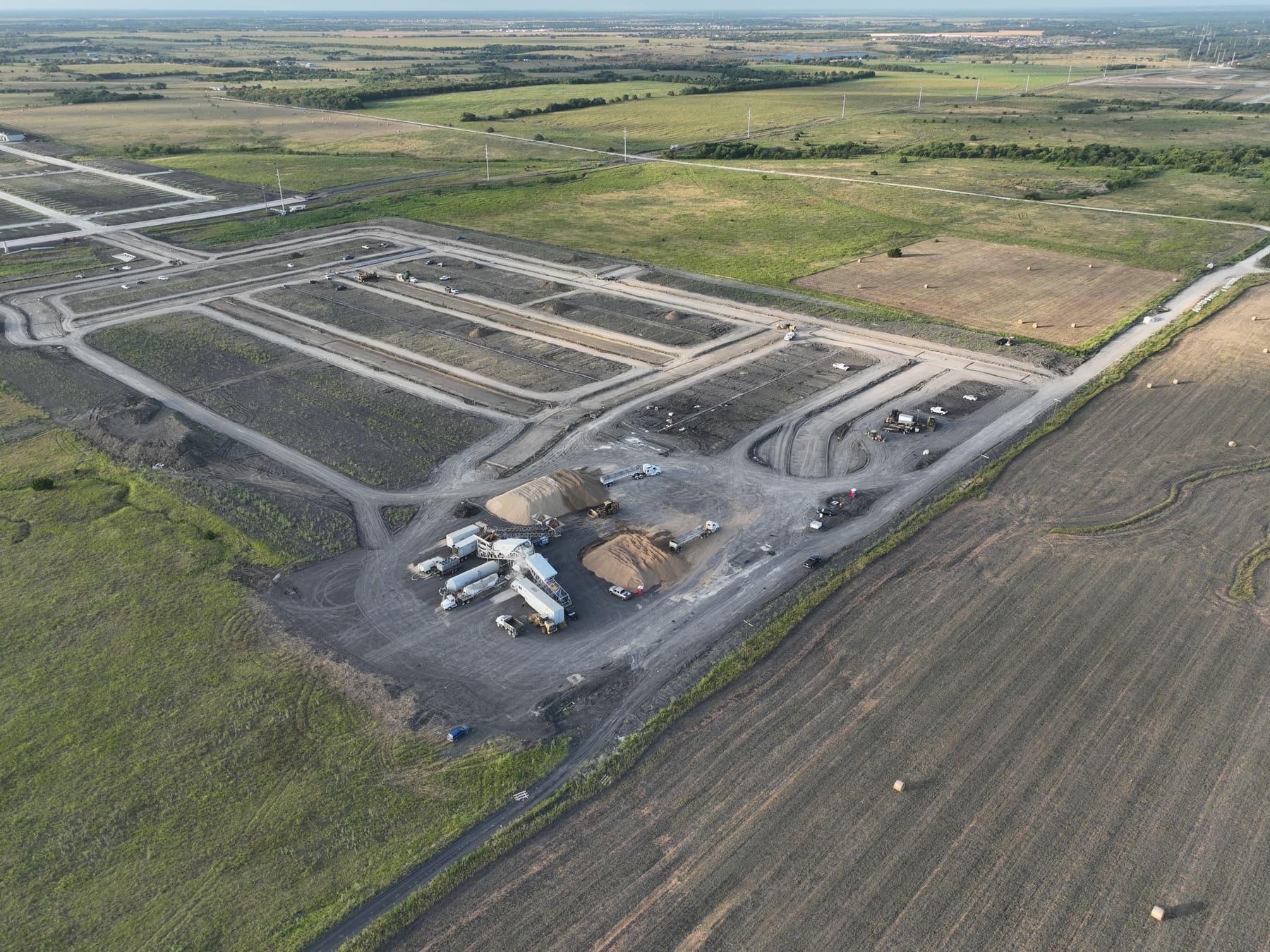 Aerial view of graded streets and homesites under construction at Cartwright Mays in Crandall, Texas