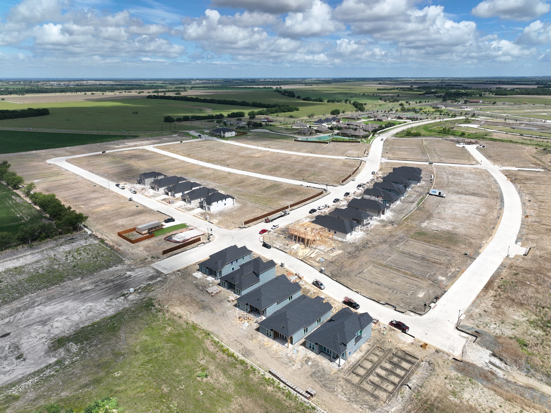 Aerial view of homes under construction on delivered lots at Clearview Ranch Phase 2 in Royse City, Texas