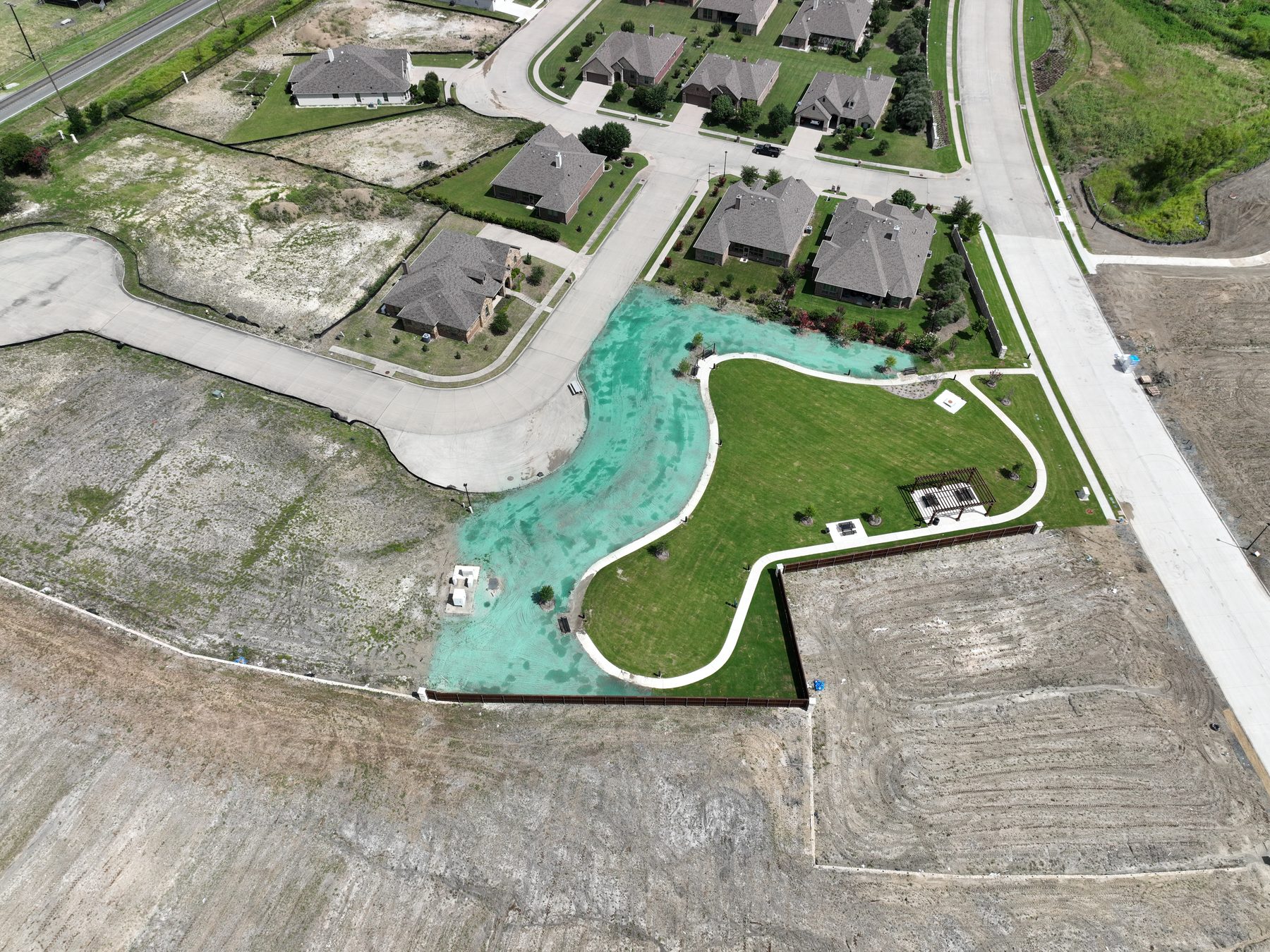 Aerial view of the completed amenity pool and finished homes at Clearview Ranch Phase 2 in Royse City, Texas