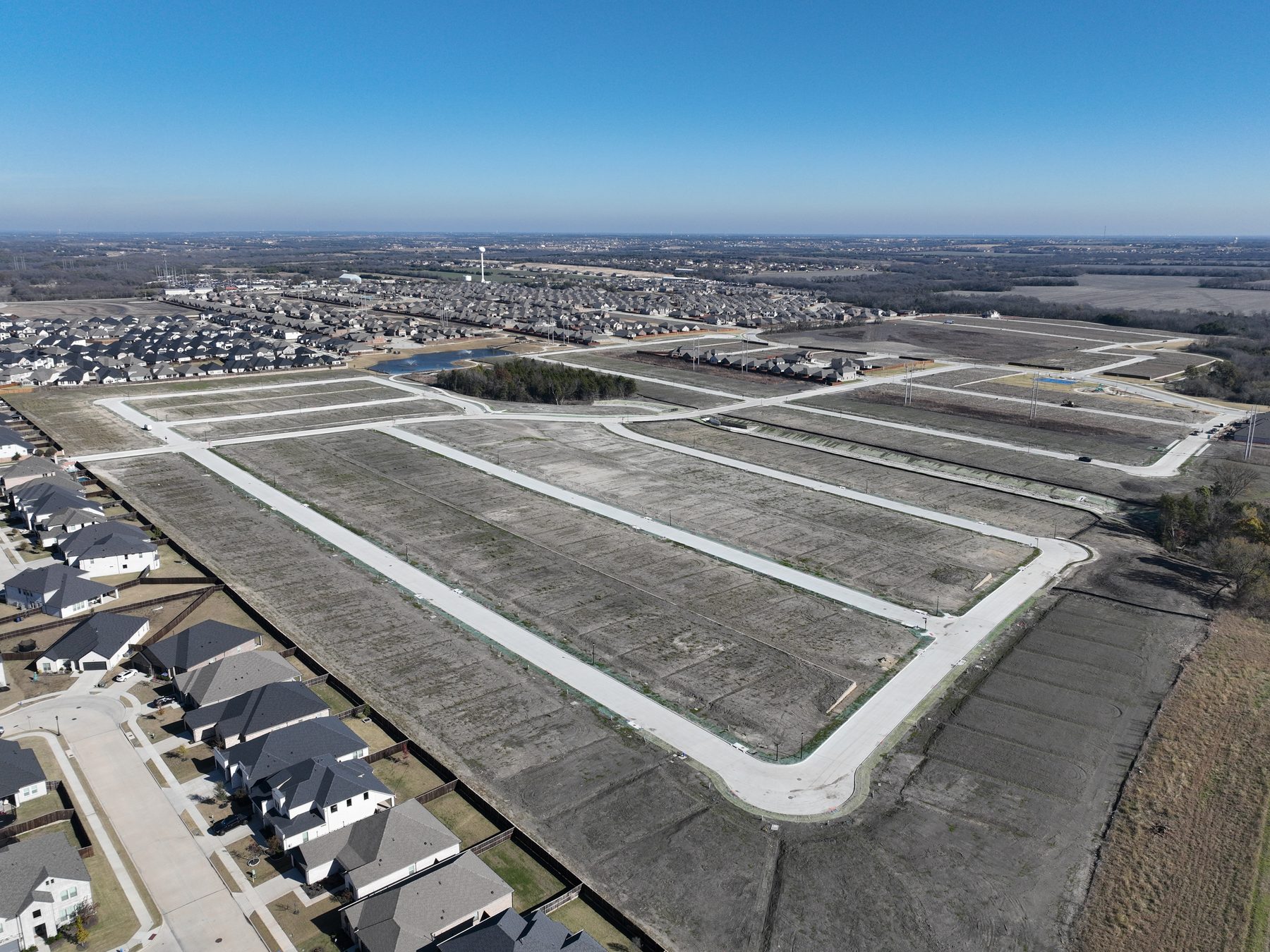Aerial view of finished, paved and drained homesites delivered at Elevon Section 1, Phase 4 in Lavon, Texas