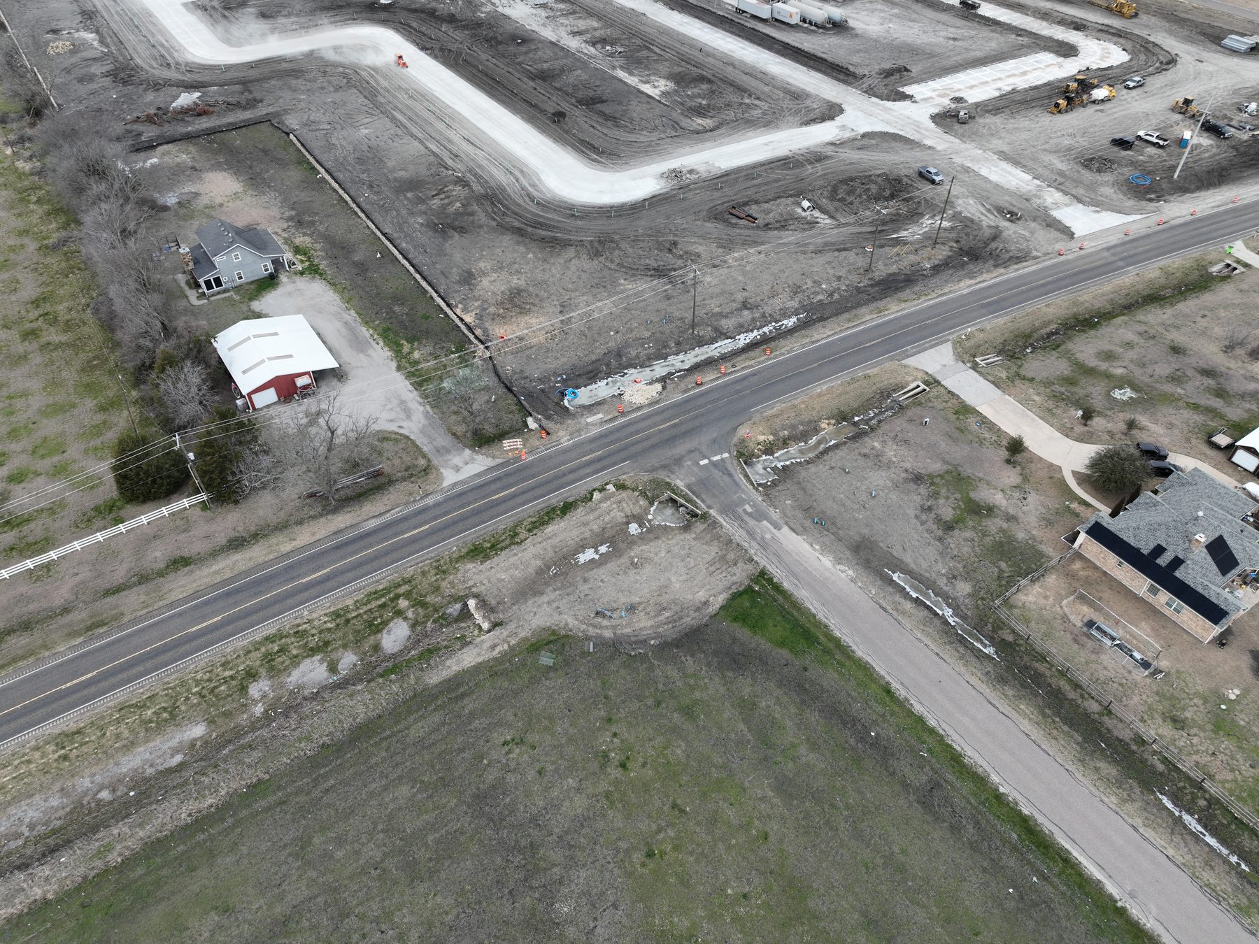Aerial view of paved streets and finished homesites at Arbor South Phase 1 in Princeton, Texas