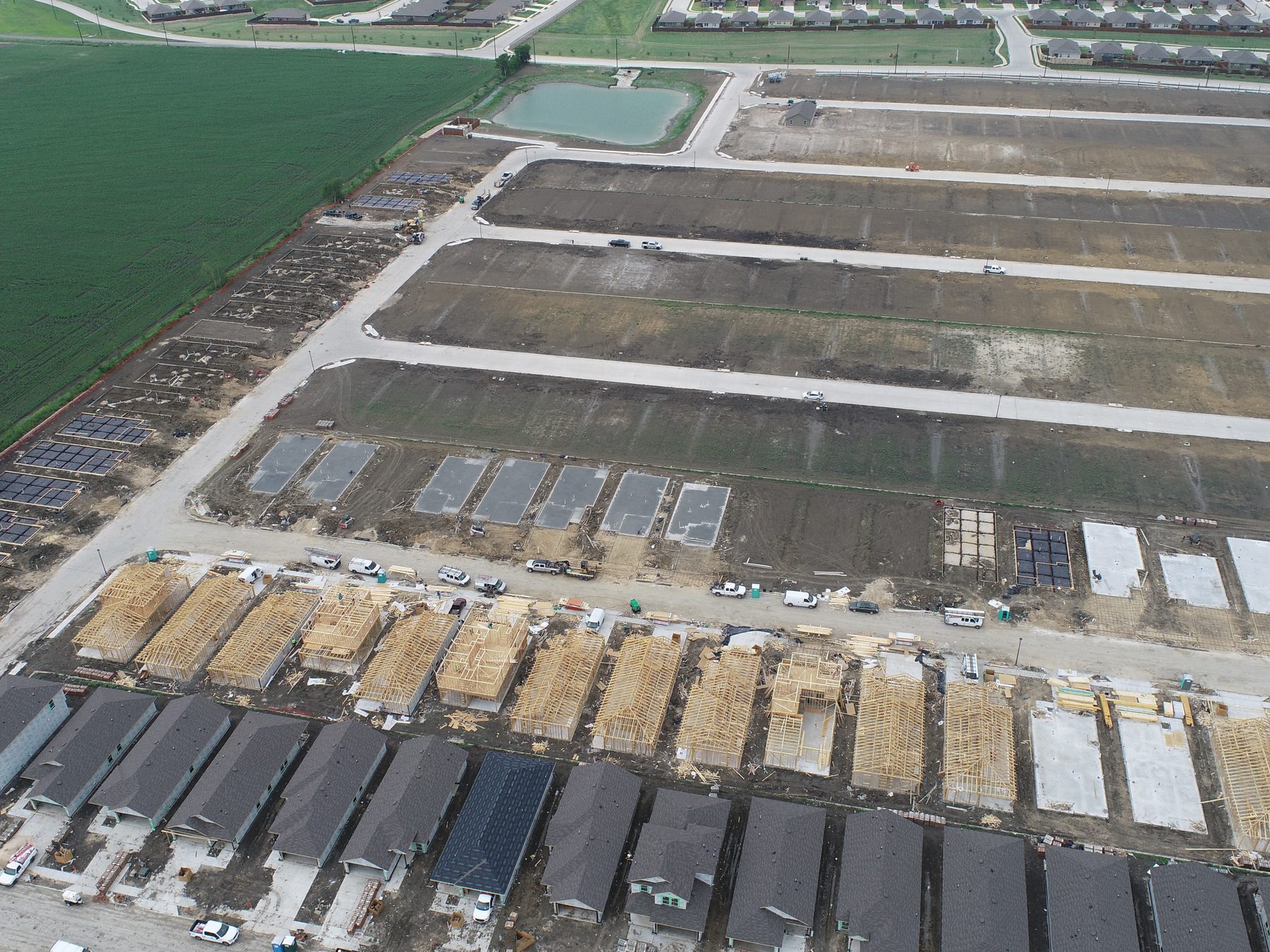 Aerial view of homes under construction on delivered lots at Magnolia Phase 10 in Josephine, Texas