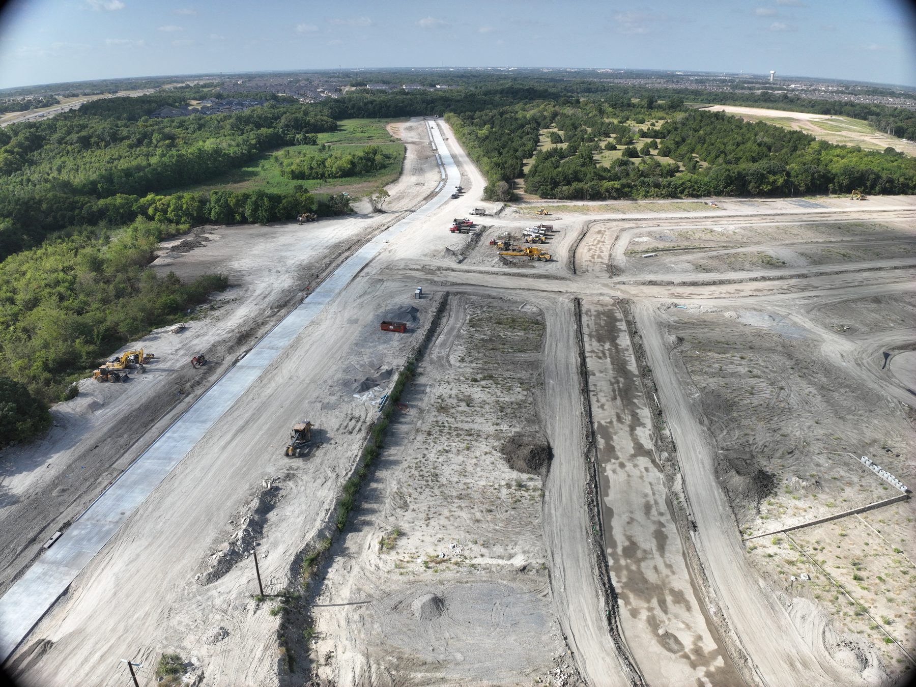Aerial view of road construction and mass grading underway at Riverstone Estates Phase 1 in Melissa, Texas