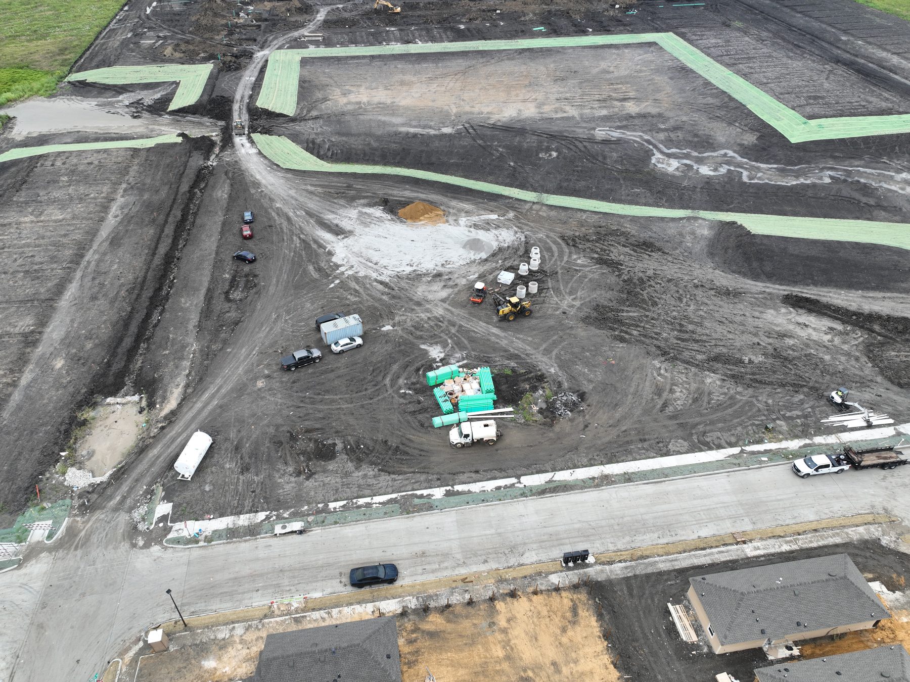 Aerial view of a contractor laydown yard at Cartwright Mays in Crandall, Texas — pipe, materials, and equipment staged ahead of the next phase of work